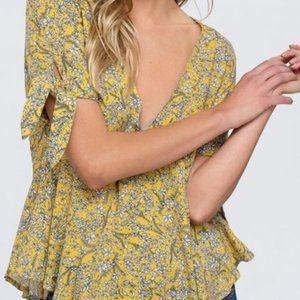 floral printed top featured in a peplum-inspired